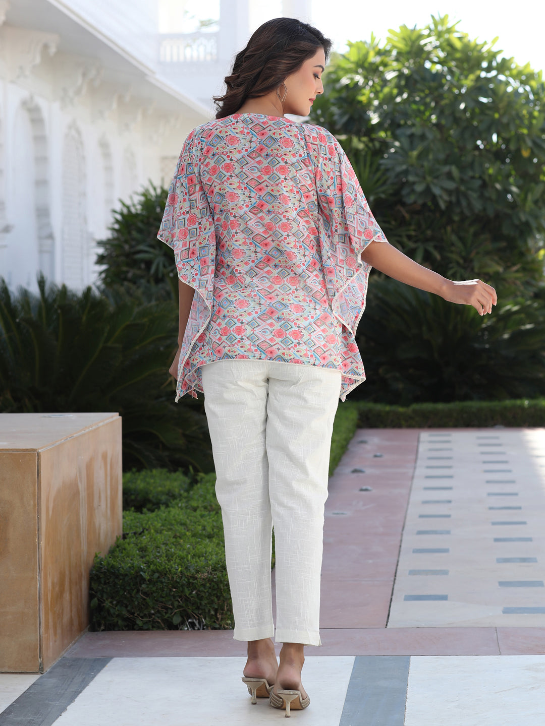 A Peach Geometric Printed Georgette Kaftan Top With Pintucks And Lace Details At The Yoke With Off- White Cotton Pants