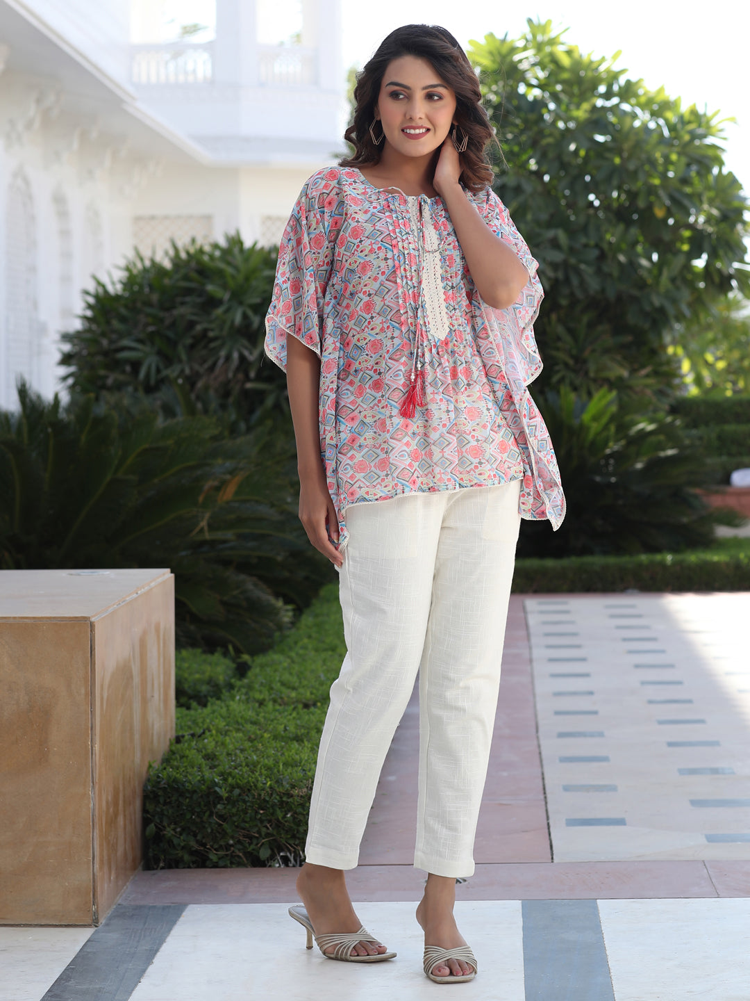 A Peach Geometric Printed Georgette Kaftan Top With Pintucks And Lace Details At The Yoke With Off- White Cotton Pants
