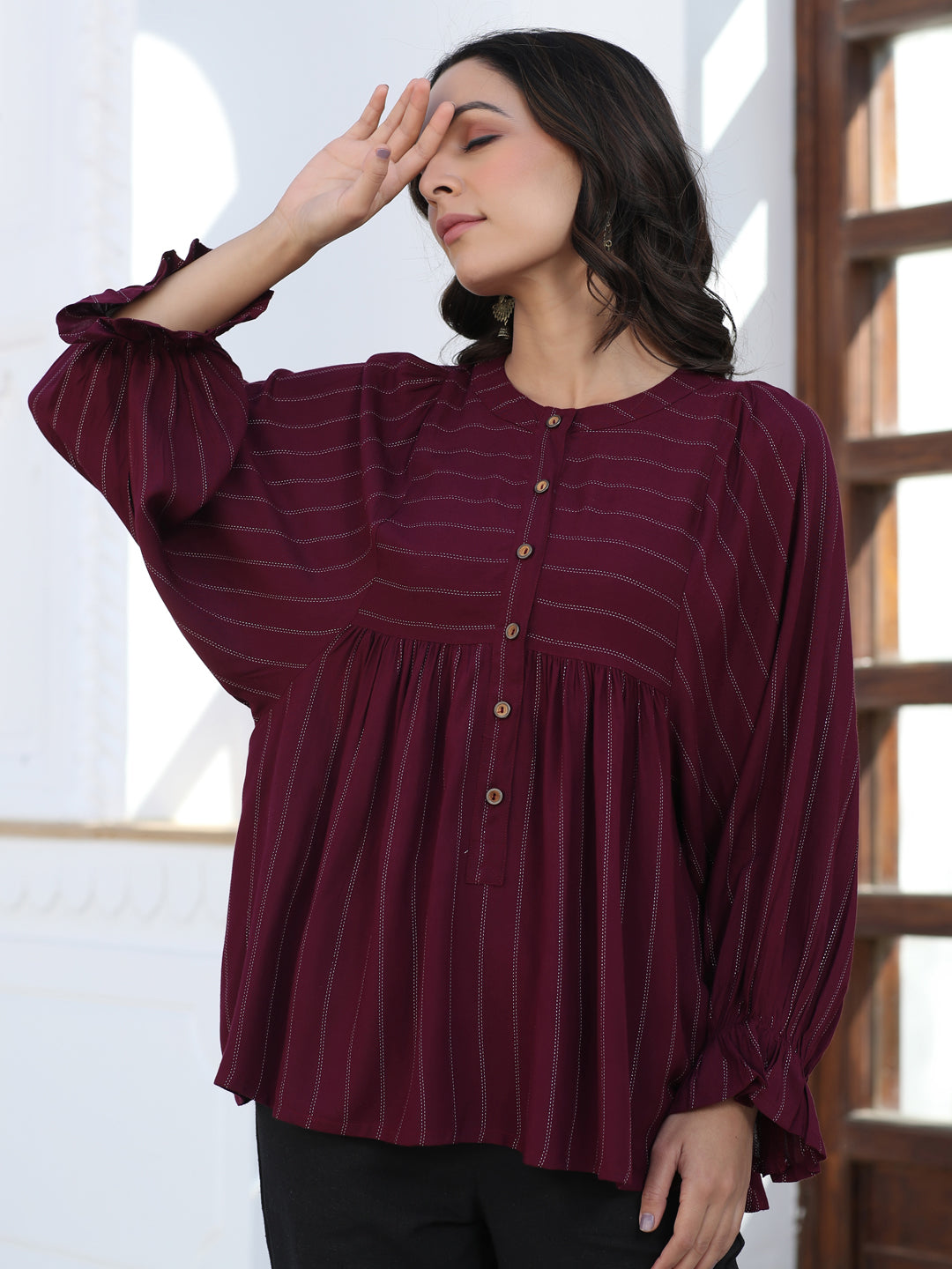 A Maroon Self Weave Rayon Lurex Gathered Top With Elasticated Gathered Sleeves With Black Pants