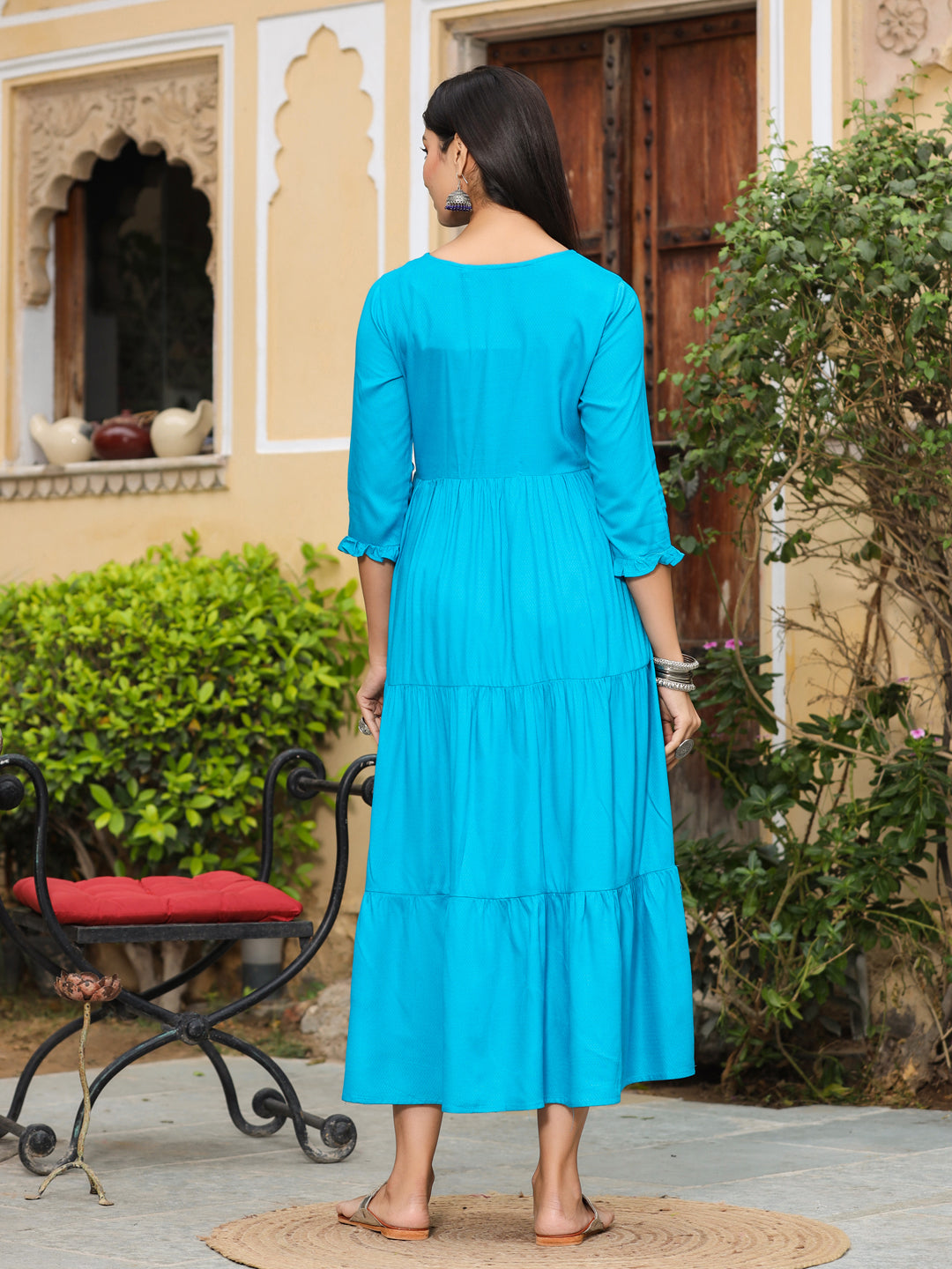 Jaipur Kurti Women Turquoise Blue Solid A-Line Dobby Dress. This Long Embroidered Dobby Dress has Ruffle Detailing on Sleeves, Round neck with 3/4th Sleeves.