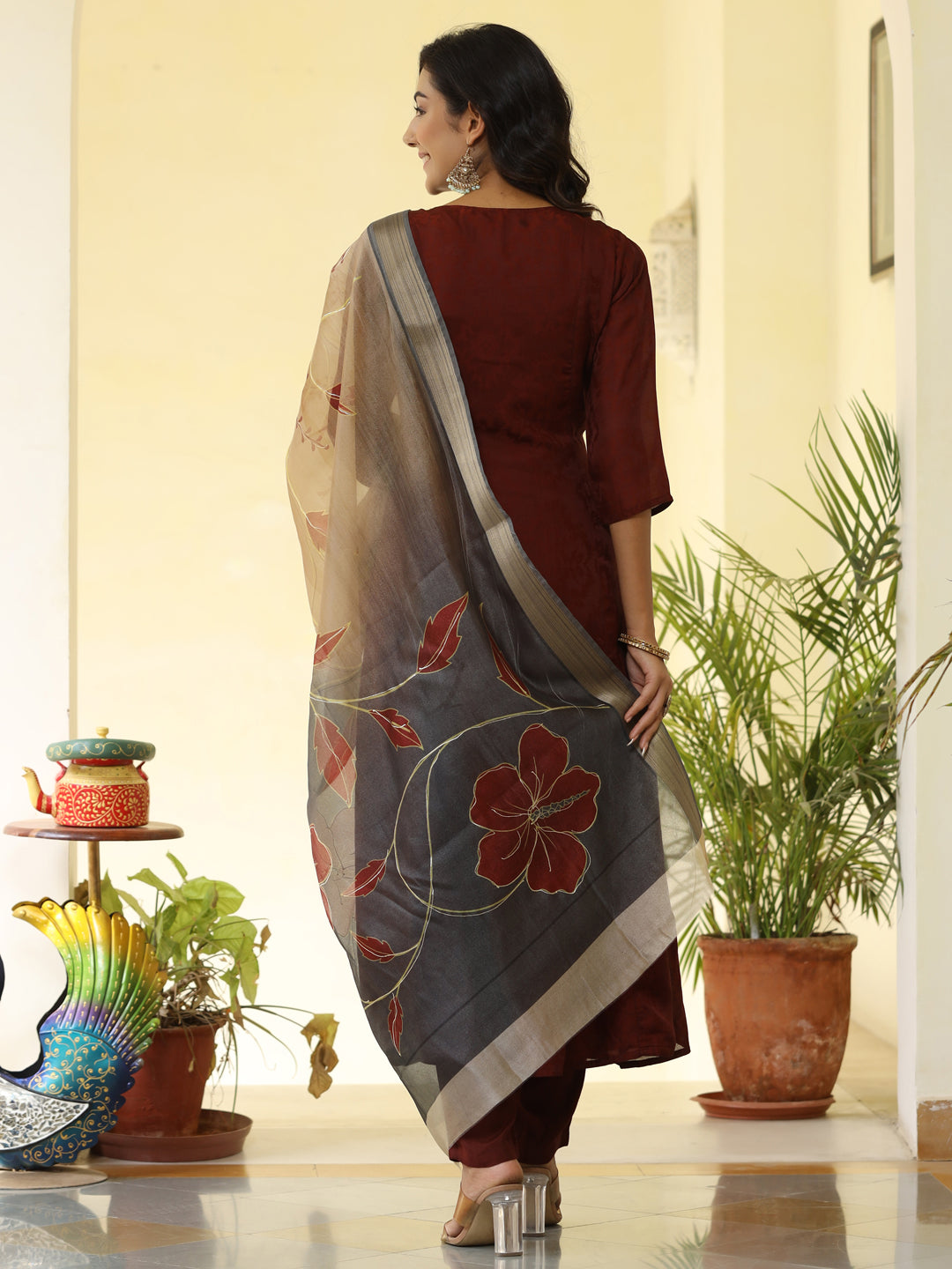 Brown Silk Pleated Straight Kurta Has Round Neck, Front Placket And Buttons With Both Side Pleats, Three Fourth Regular Sleeves, Flared Hemline, Cotton Mulmul Lining Is Attached To Kurta, Brown Pants Has Both Side Pocket And Partially Elastic Waist, Organza Printed Dupatta.