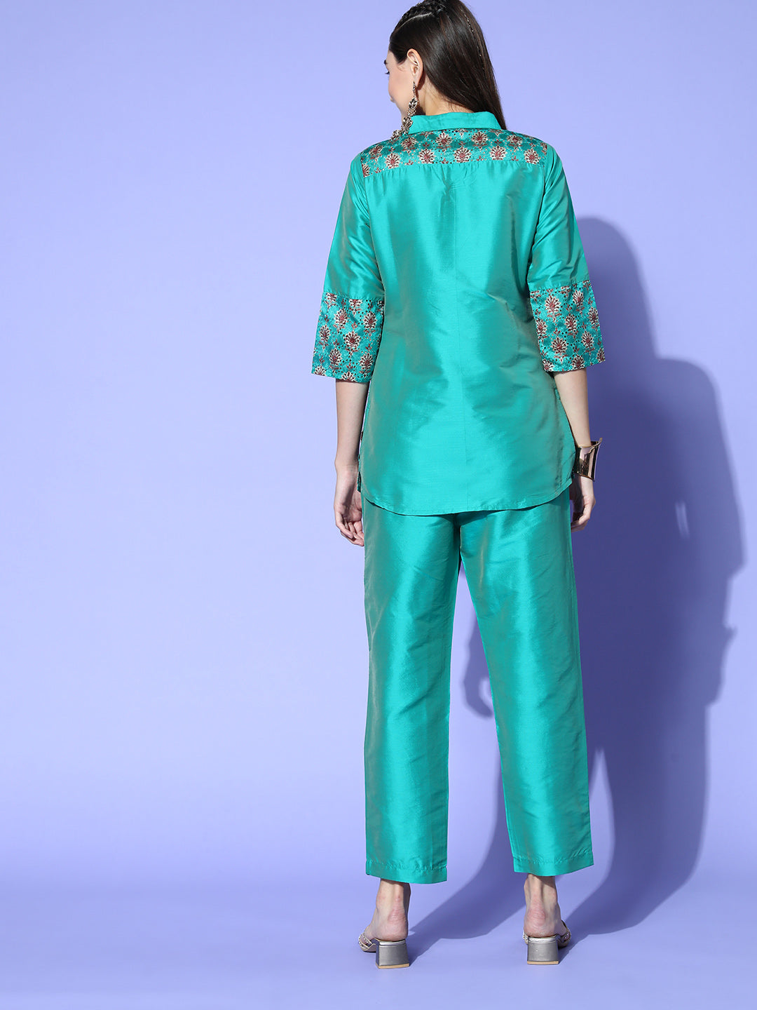 A Teal Color Silk And Shifili Embellished Shirt Paired With Solid Silk Trousers