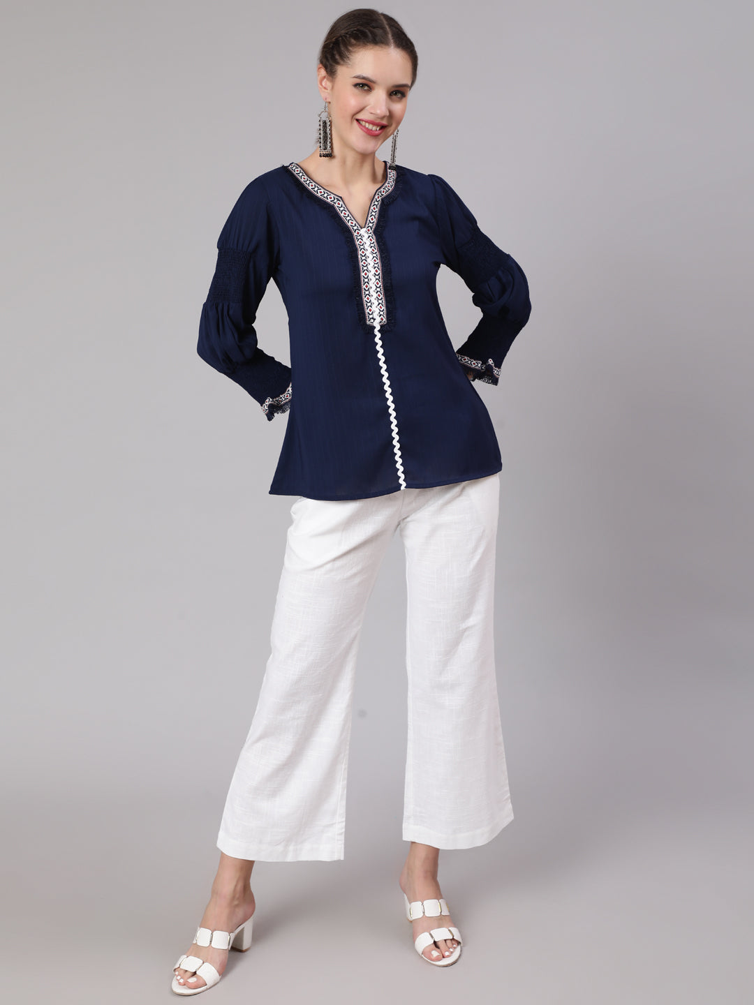 A Blue Silk Blend Lace Embellished Top With Smocked Sleeves With Wide-Leg White Pants