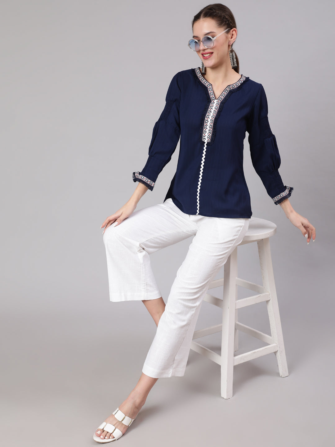 A Blue Silk Blend Lace Embellished Top With Smocked Sleeves With Wide-Leg White Pants
