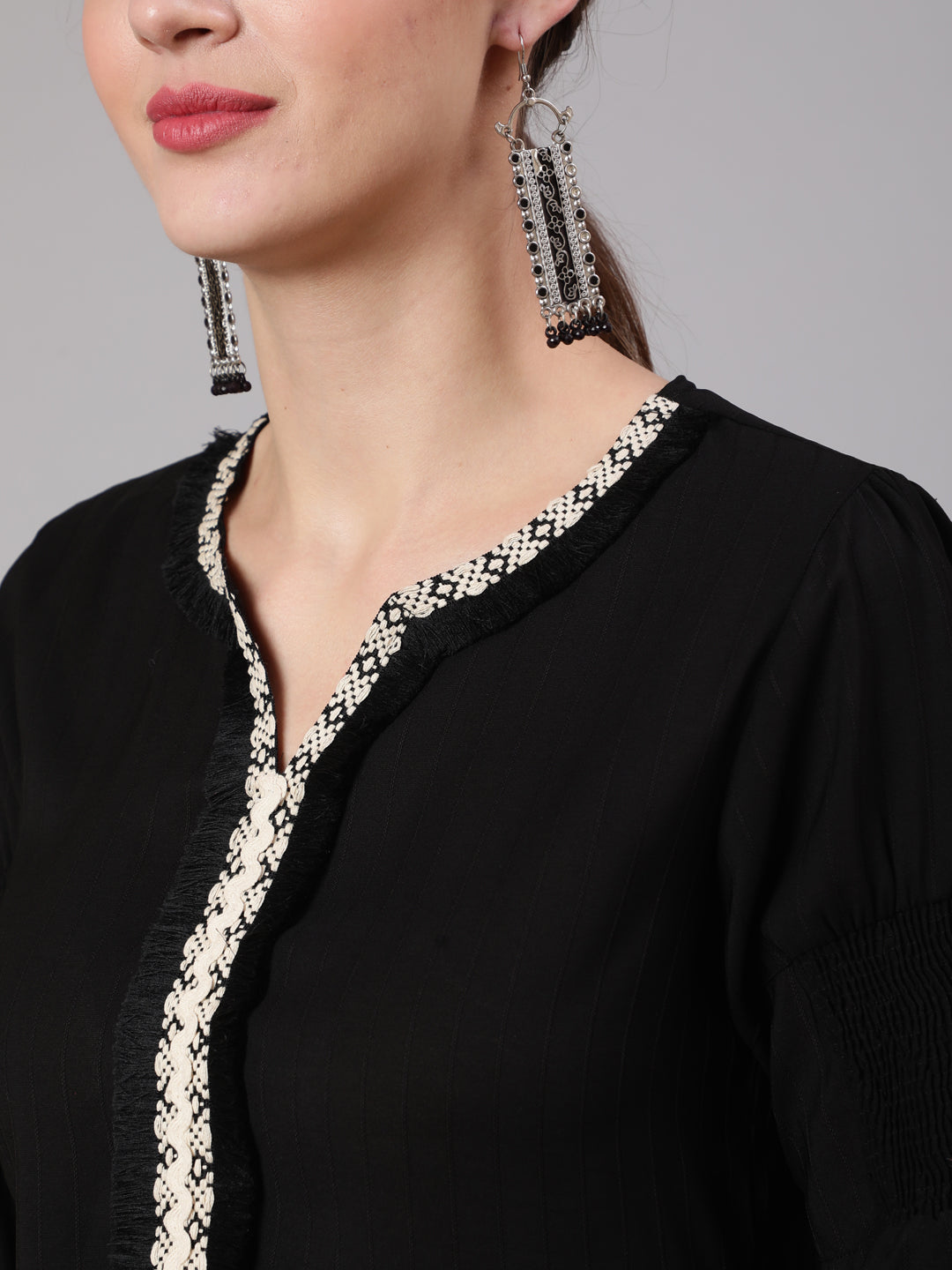 A Black Poly Silk Lace Embellished Top With Smocked Sleeves With Wide-Leg White Pants