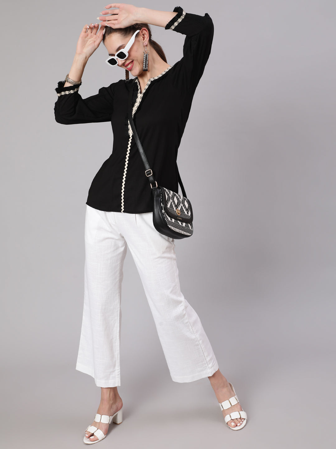 A Black Poly Silk Lace Embellished Top With Smocked Sleeves With Wide-Leg White Pants