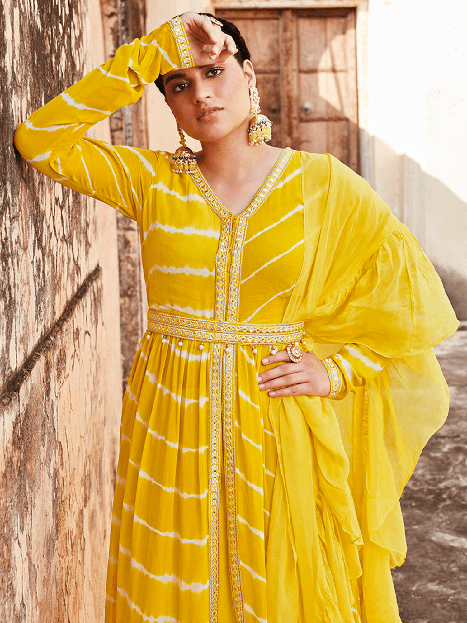 Yellow Lehriya Flared Jacket With Skirt And Dupatta And Mirror Work Belt