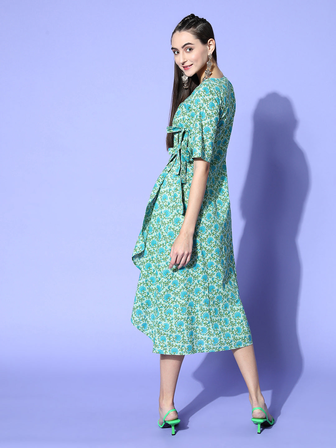 Green Floral Printed Cotton Embroidered Angrakha Style Dress, Has A Front Opening, Has a V neck, Short Regular Sleeves, Tie-Up At The Waist And A Frill On The Front, Has A Flared Hem