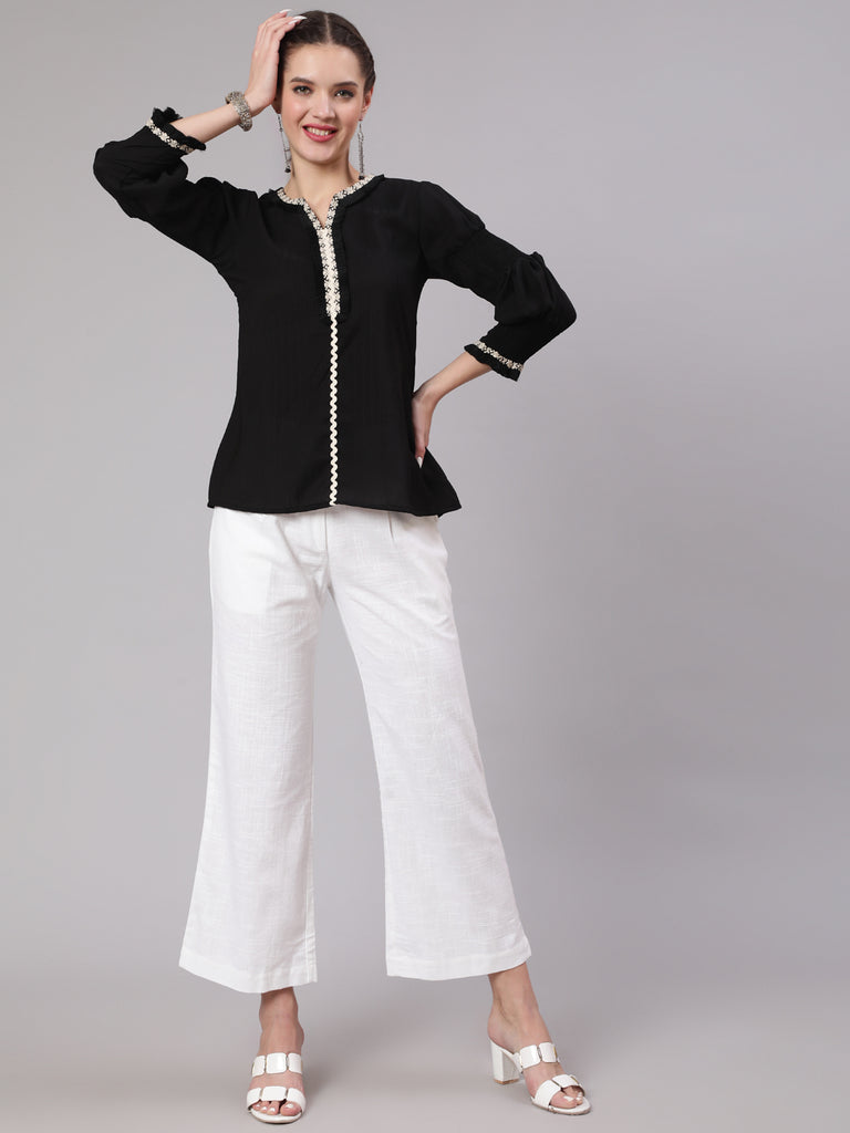A Black Poly Silk Lace Embellished Top With Smocked Sleeves With Wide-Leg White Pants