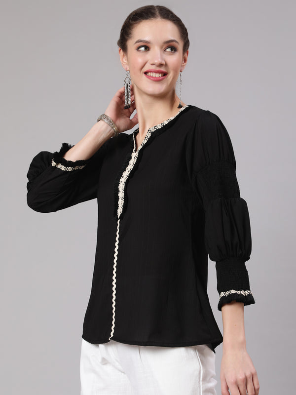 A Black Poly Silk Lace Embellished Top With Smocked Sleeves With Wide-Leg White Pants